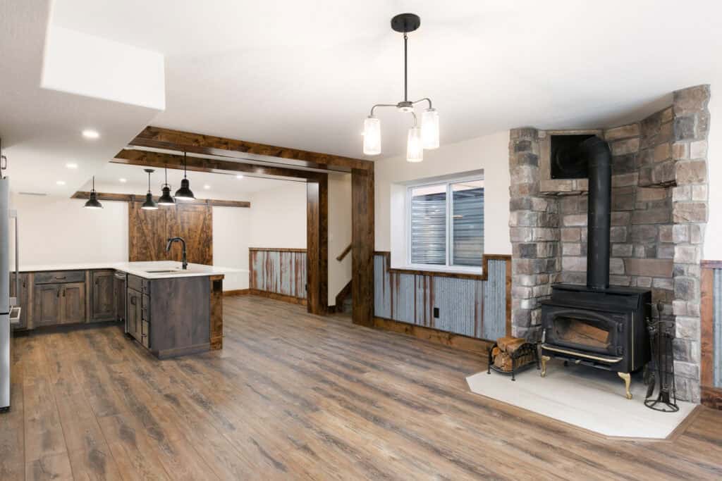 Basement Remodeling with barndoor and faux beams