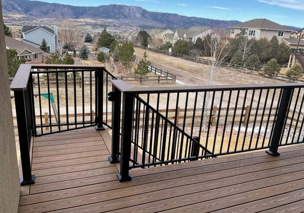 Outdoor Living with Deck Remodel with iron balusters